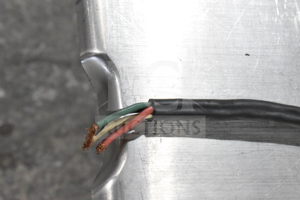 Close-up of exposed wiring on a Hobart 6801 Commercial Meat Saw, 200-230 Volts, 3 Phase, showing wear.