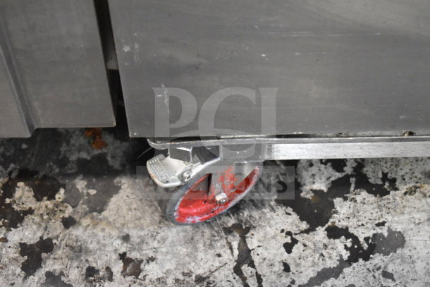 Convotherm CGS-20.20 combi oven wheel detail showing red caster and metal frame, indicating mobility and industrial design.