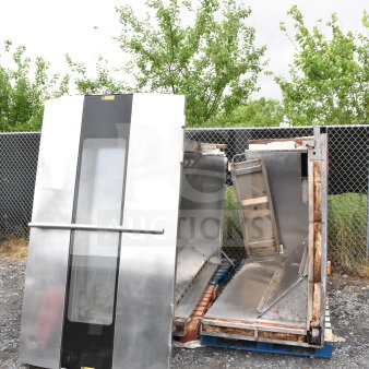 Commercial roll-in rack proofer, disassembled, stainless steel panels, needs assembly, visible wear.