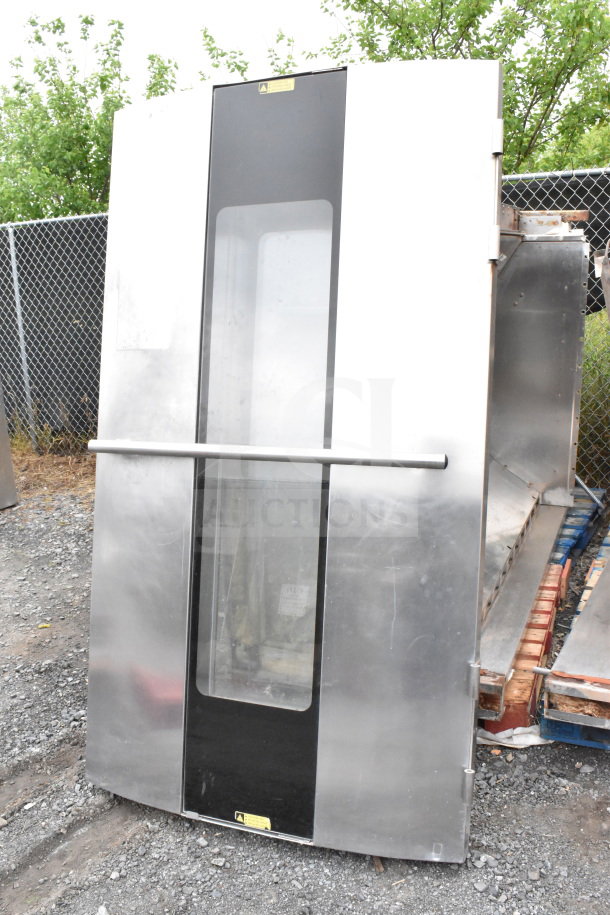 Commercial roll-in rack proofer, stainless steel, door with window, needs assembly, exterior wear visible.