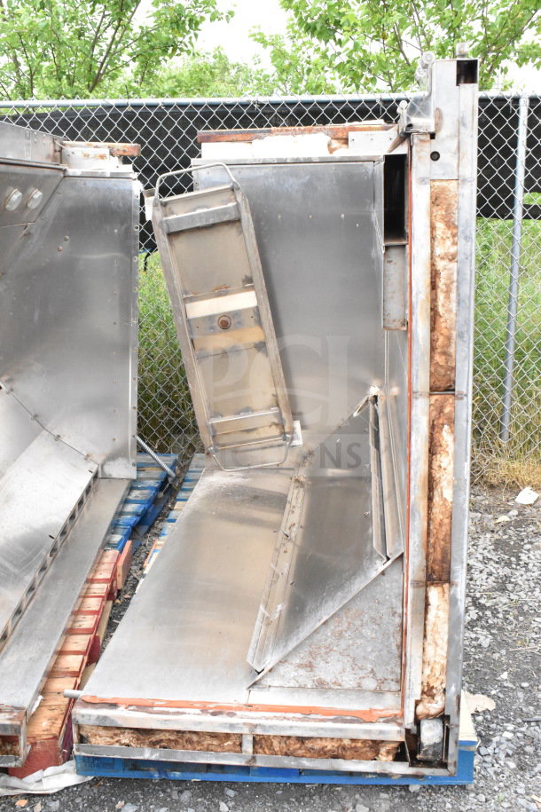 Commercial Roll In Rack Proofer needing assembly, showing stainless steel parts, wear, and rust.