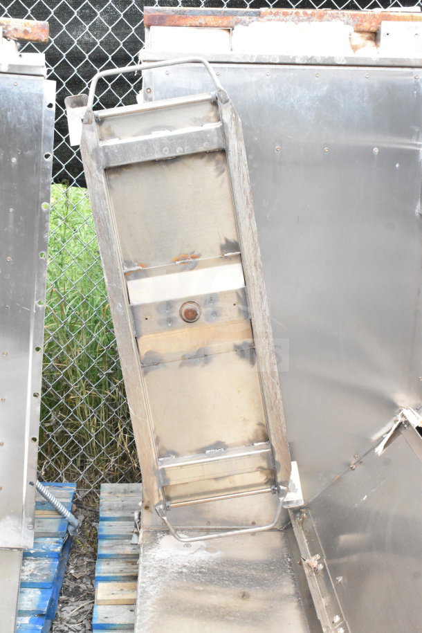 Commercial Roll In Rack Proofer needing assembly. Visible metal frame with bolts and welds, showing industrial use.