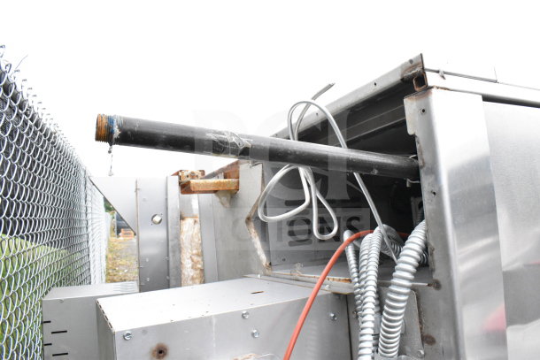 Commercial roll-in rack proofer, disassembled state with cables visible, needs assembly. Rugged stainless steel exterior.