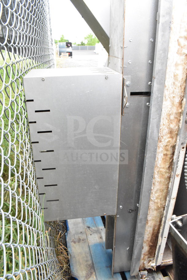 Commercial roll in rack proofer, needs assembly, includes metal and insulation parts, located outdoors on wooden pallets.