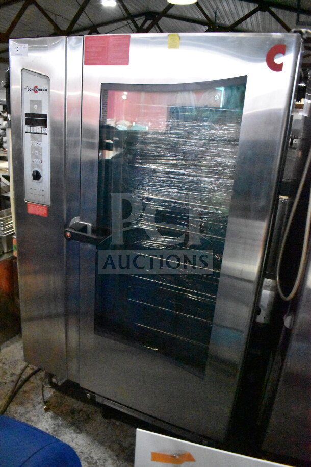 2016 Convotherm OGB-20.20 commercial combi convection oven. Natural gas, 265,500 BTU, stainless steel, roll-in rack included.
