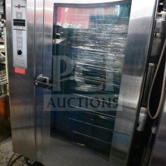 2016 Convotherm OGB-20.20 commercial combi convection oven. Natural gas, 265,500 BTU, stainless steel, roll-in rack included.