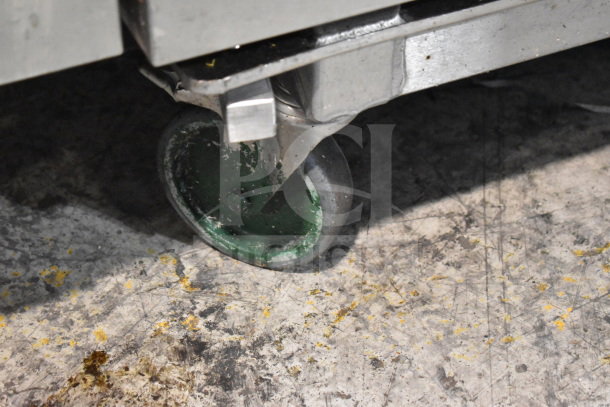 2016 Convotherm OGB-20.20 combi convection oven caster wheel, showing wear but functional. 265,500 BTU, roll-in rack compatible.