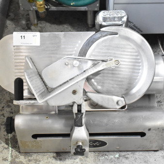 Globe Commercial Countertop Meat Slicer with Blade Sharpener, 115 Volts, 1 Phase, stainless steel, used condition.