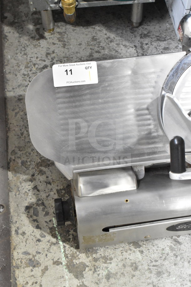 Globe Commercial Countertop Meat Slicer with blade sharpener, stainless steel, 115 volts, 1 phase, includes auction tag.