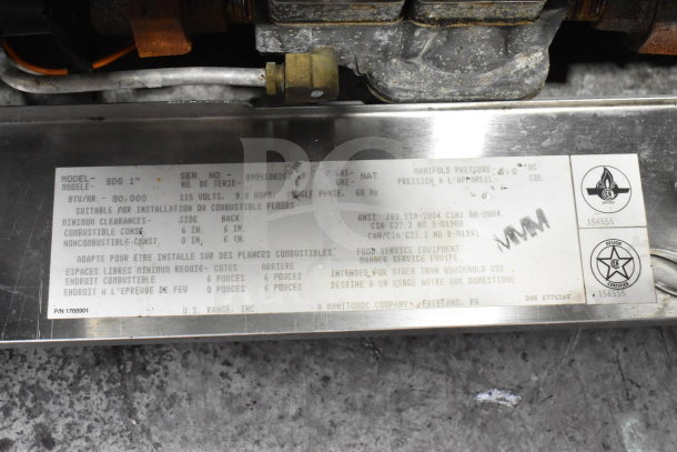 Garland SDG 1 commercial convection oven label with specifications: 80,000 BTU, natural gas, 115V, 9.8A, single phase.