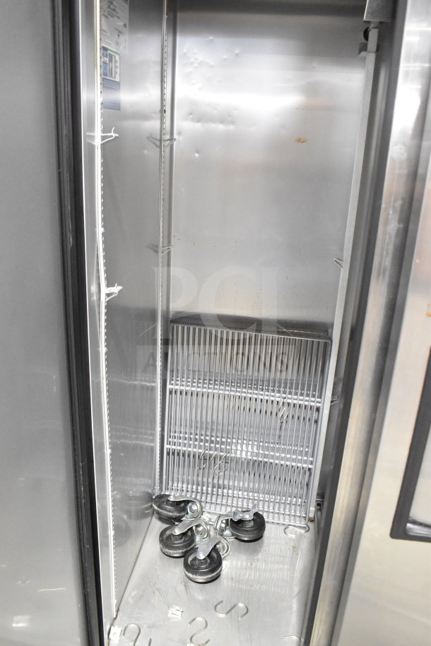 2021 True T-35-HC Commercial Cooler, 2-door, 115V, 1 phase, interior racks, good condition, shelving hooks, caster wheels included.