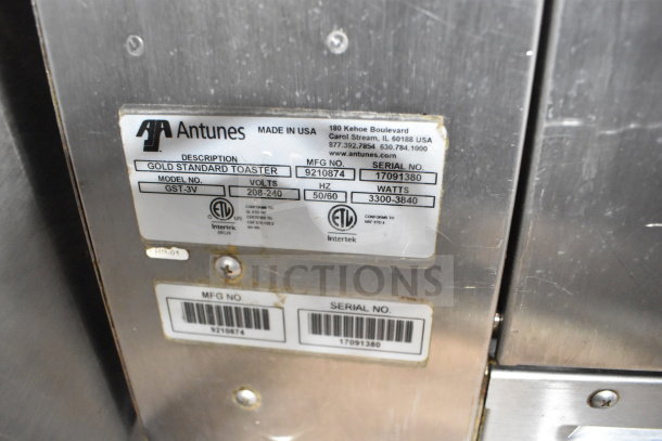 AJ Antunes GST-3V Commercial Bun Toaster label on stainless steel surface, showing model, volt range 208-240. Made in USA.