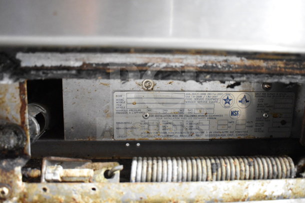 Garland SunFire X36-6R commercial gas range label, showing model and specifications. Rust visible; indicates used condition.
