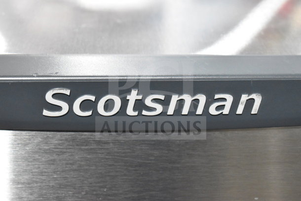 2022 Scotsman HID312A-1A commercial ice machine label, stainless steel finish. Ideal for countertop use, 12 lb. bin capacity.