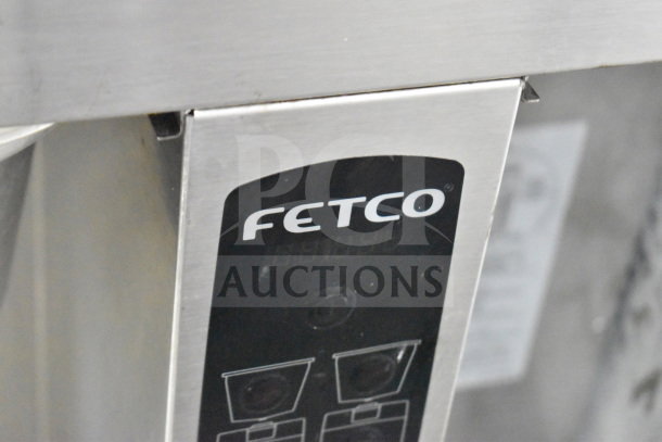 Fetco CBS-2052e double coffee machine, commercial countertop model, 120/208-240V, 1/3 phase; branded panel visible.