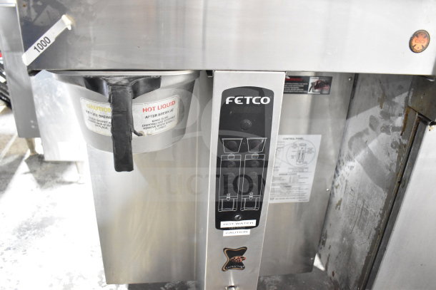 Fetco CBS-2052e commercial countertop double coffee machine, stainless steel, 120/208-240V, 1/3 phase, caution labels visible.