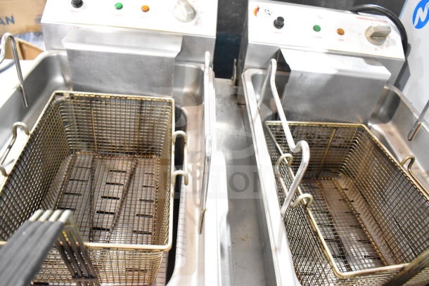 Cooking Performance Group DF-18-2 dual tank electric fryer with two metal baskets. 30 lb capacity, 208/240V, 1 phase.