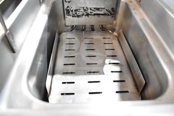 Cooking Performance Group DF-18-2 fryer tank interior, stainless steel with heating elements and drain grate visible, in good condition.