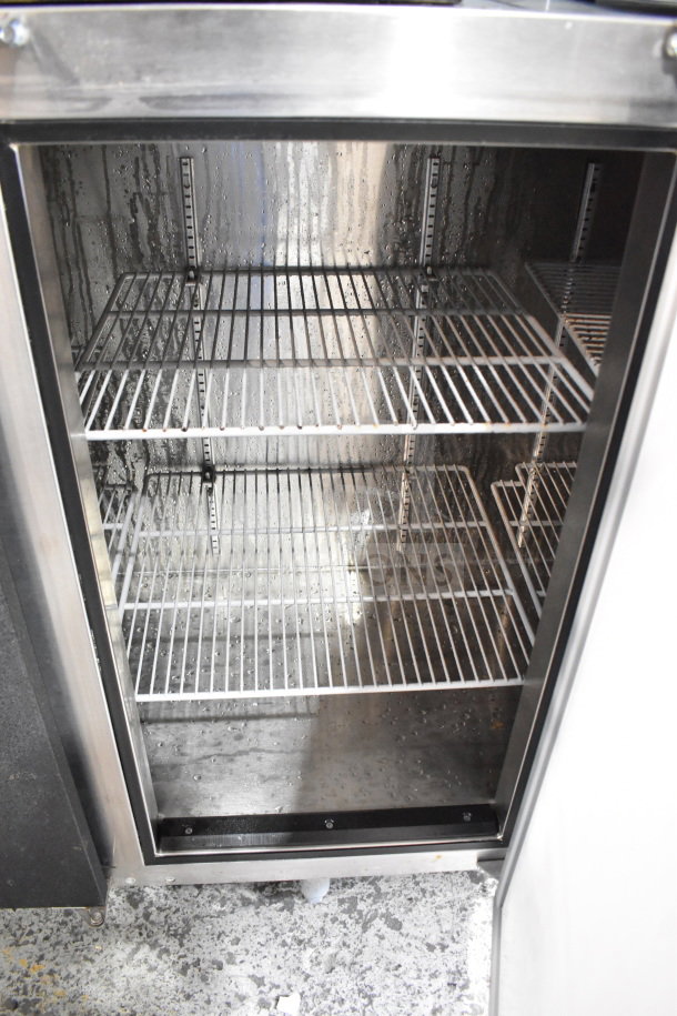 Glastender ND72-L1-BN commercial 3-door back bar cooler, 115 volts, 1 phase, stainless steel, interior view with wire shelves.