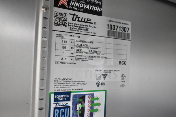 Label of 2022 True T-23F-HC Commercial Freezer, showing model, 115V, 60Hz, 1 phase details, and refrigerant info.
