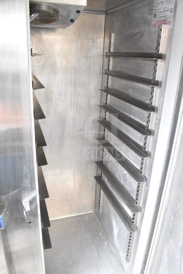 Continental 2R commercial 2-door reach-in cooler, stainless steel interior, adjustable shelves, 115V, 1 phase.