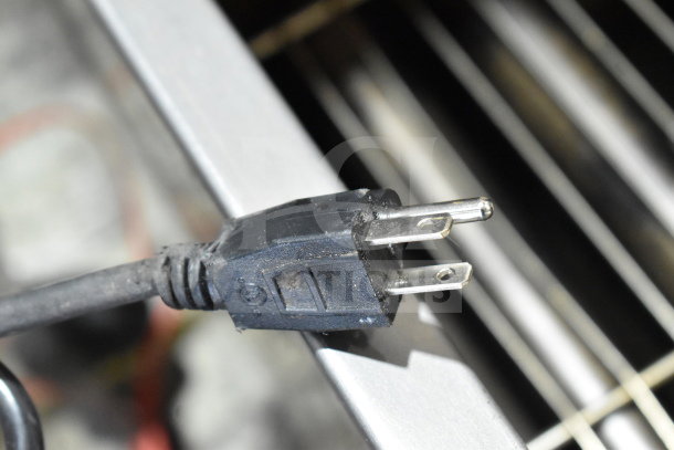 Three-prong plug of 2025 Jun-Air 86R-3MN1-DSBHH Nitro Brew Nitrogen Generator, 120V, showing wear.