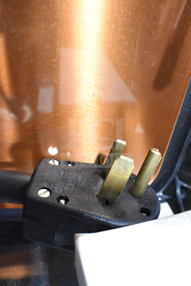 Thermoplan Mastrena M2-CS espresso machine plug and copper detail, showcasing 208V rating and robust build.