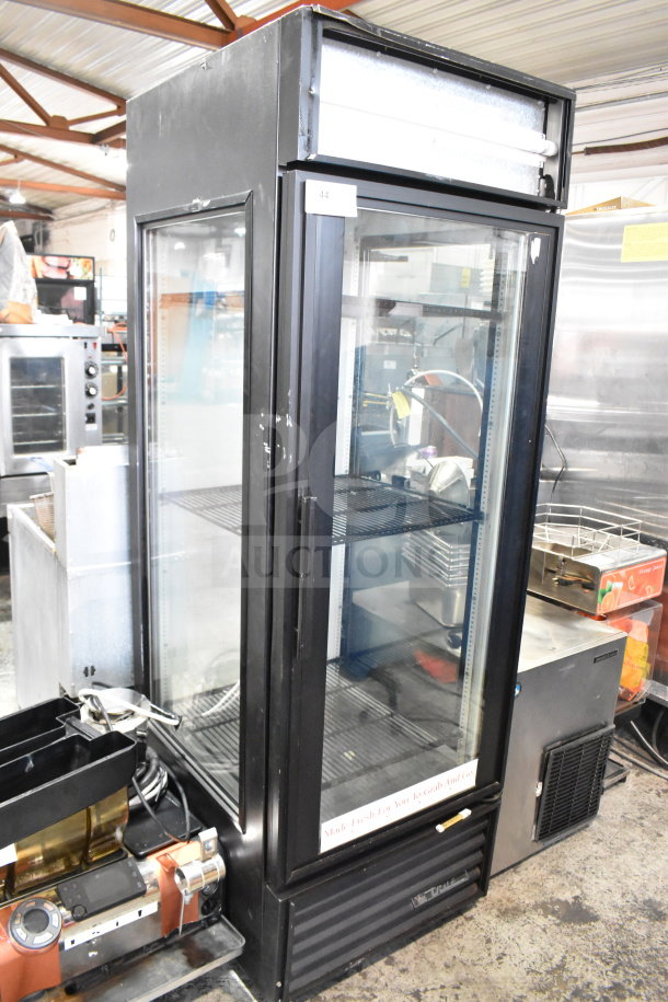 True GEM-23 Reach-In Cooler Merchandiser, single door, 115 volts, 1 phase. Features glass front, black exterior, used condition.