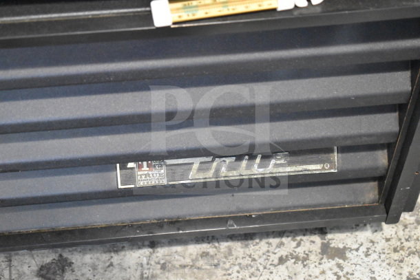True GEM-23 commercial single door cooler, black exterior, visible True brand nameplate, 115 volts, 1 phase.