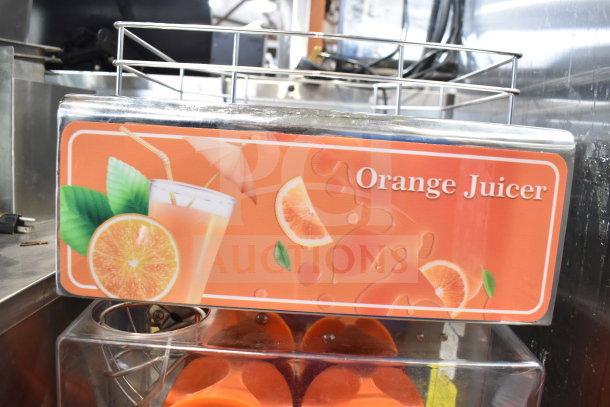 Vevor 2000E4 Commercial Citrus Juicer, 110V, 1 Phase, features orange-themed design, excellent condition, model visible.