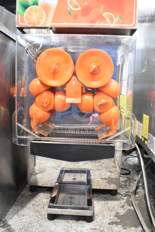 Vevor 2000E4 commercial citrus juicer, 110V, 1 phase, features orange components. Model label visible. Good condition.