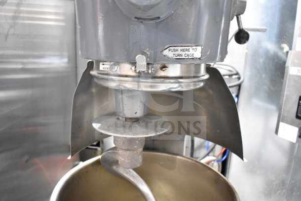 Hobart D300T commercial 30 quart mixer with bowl and dough hook, 200V, 3-phase. Visible label reads "Push here to turn cage."