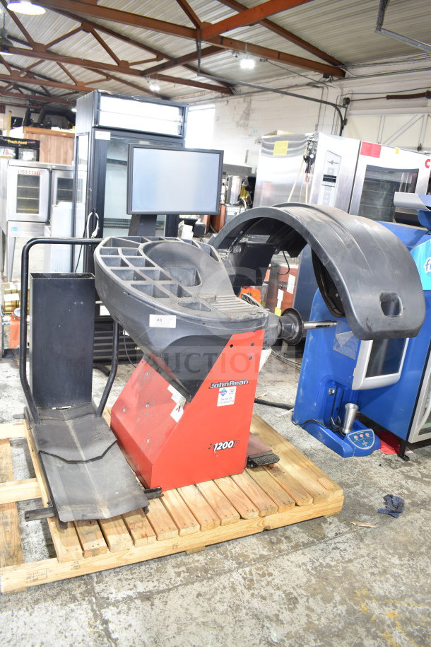 JohnBeam 1200P Commercial Floor Style Balancer, red base, 230 Volts, 1 Phase, good condition, visible brand labels.