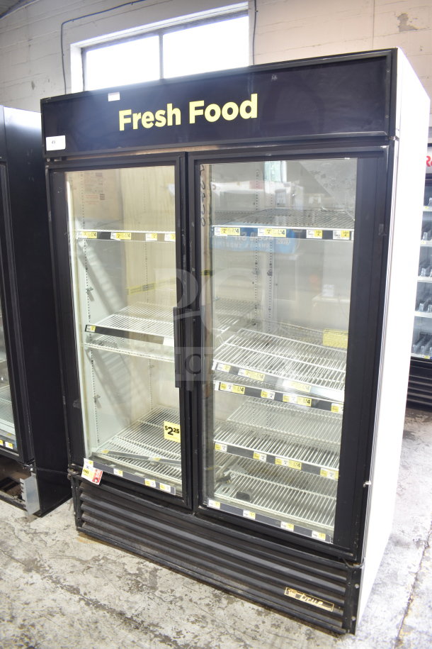 True GDM-49 commercial 2-door reach-in cooler, tested and working, 115 volts, 1 phase, interior shelves, "Fresh Food" label.