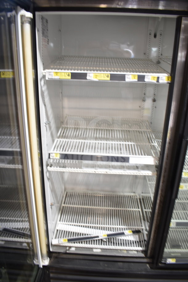 True GDM-49 Commercial 2 Door Reach In Cooler, tested and working, featuring adjustable shelves and 115V operation.