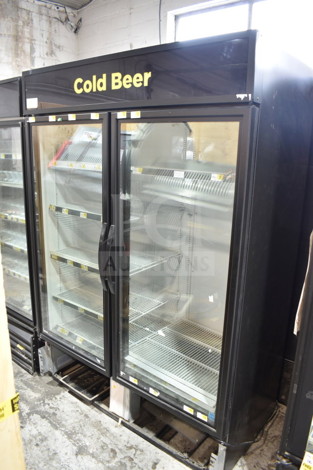 2019 True GDM-49-HC commercial 2-door reach-in cooler, 115 volts, 1 phase, black exterior, shelves visible, tested and working.