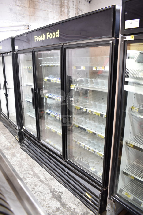 True GDM-72-LD commercial 3-door cooler merchandiser, features glass doors, black frame, tested and working condition.