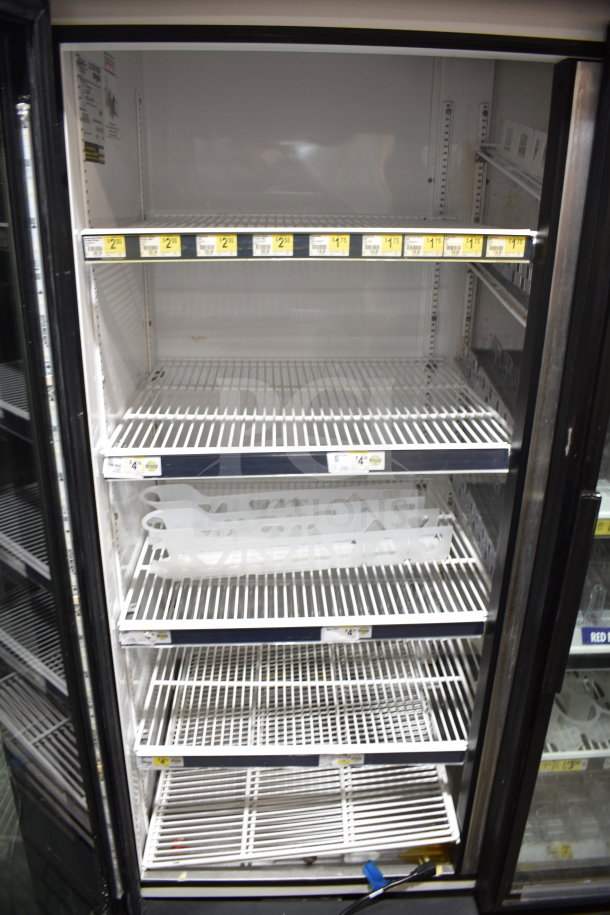 True GDM-72-LD commercial 3-door cooler, tested and working, with shelves and price tags visible, 115 volts, 1 phase.