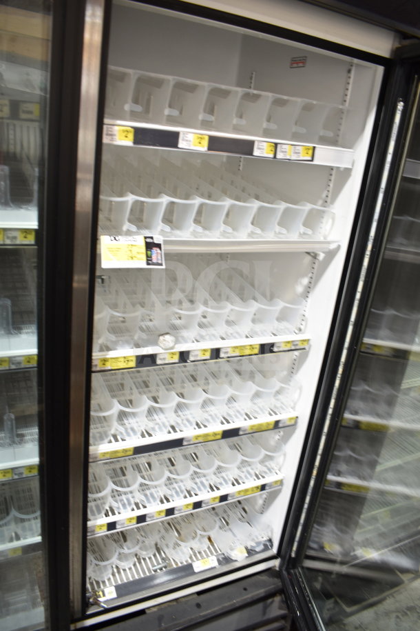True GDM-72-LD commercial 3-door cooler merchandiser, 115 volts, tested, with adjustable white shelves, brand labels visible.