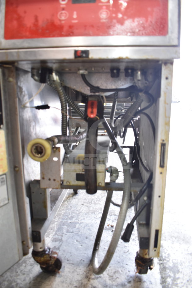 Vulcan 1ERD50 commercial electric fryer, floor style, on casters. Model 1ERD50, 480V, 3 phase. Visible wiring and components.