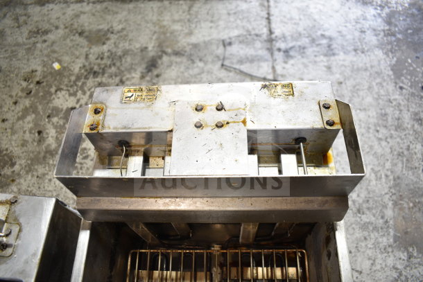 Vulcan 1ERD50 commercial electric deep fat fryer, on casters, 480V, 3-phase, visible wear, warning labels present.