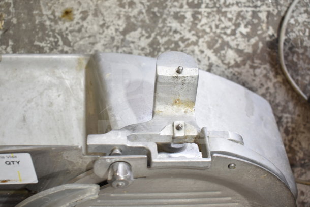 Hobart 2612 commercial countertop meat slicer, visible wear, durable metal construction, model tag visible.