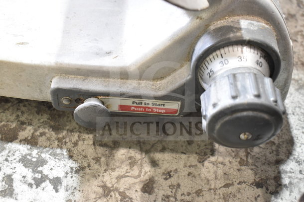 Hobart 2612 Commercial Meat Slicer, 120V, 1 Phase. Visible dial for thickness adjustments, "Pull to Start, Push to Stop" label.