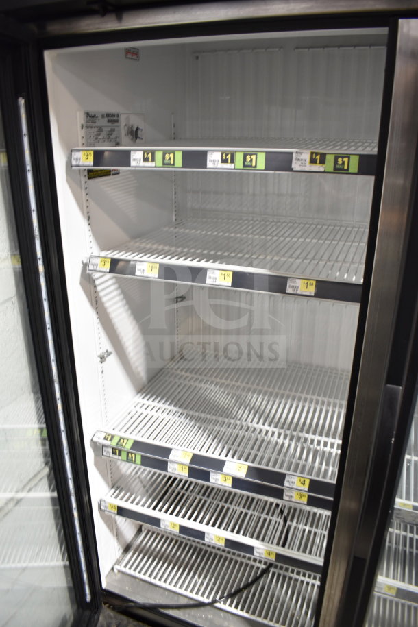 2016 True GDM-72F-HC commercial 3-door reach-in freezer. Tested and working, 115/208-230 volts, 1 phase. Interior shelving shown.