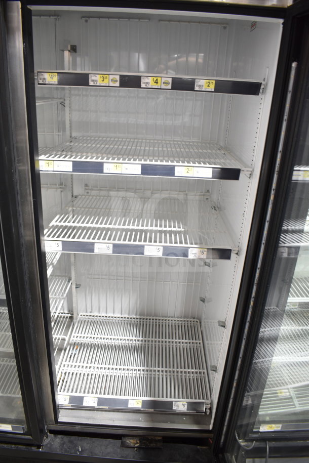 2016 True GDM-72F-HC 3-door reach-in freezer merchandiser, tested, working, 115/208-230V, 1 phase, shelves with price labels.
