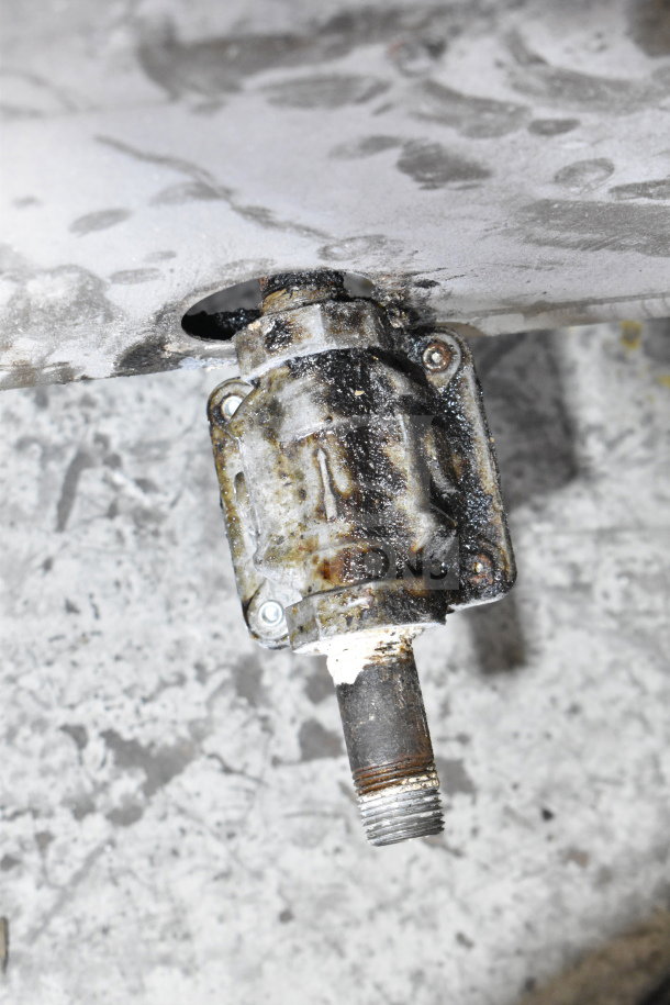 Vulcan Commercial Griddle component, showing a worn and rusted connector. Needs cleaning and maintenance.