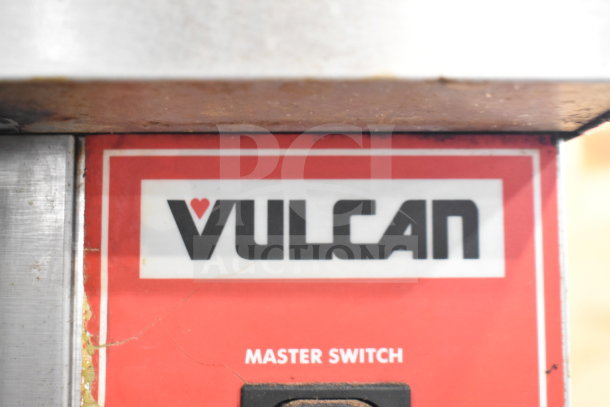 Vulcan SG4D-4 convection oven label showing logo and master switch, indicating brand and model for commercial use.