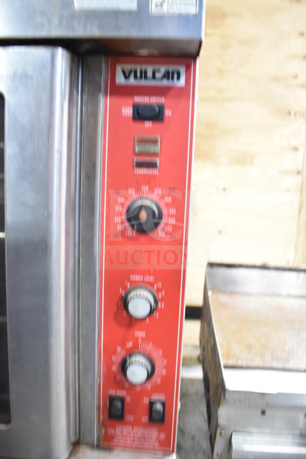 Vulcan SG4D-4 commercial convection oven, view-through doors, thermostatic controls, on commercial casters, visible control panel.