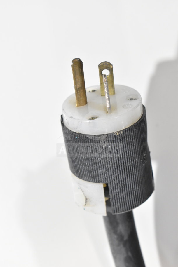 Close-up of a power plug for a McCray SC-0030E-4-LS-B merchandiser display case, 115 volts, 1 phase.