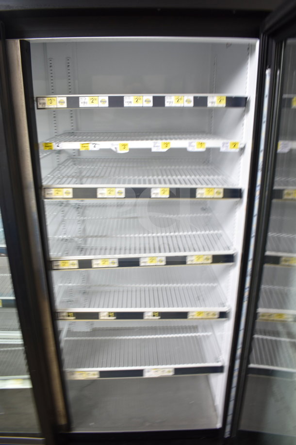 2016 True GDM-72-HC commercial 3-door reach-in cooler, 115V, 1 Phase, tested and working, with multiple shelves.